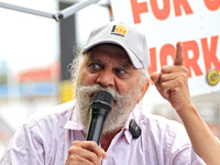 Retired lawyer and local resident Amarjeet Sidhu speaks to participants during a protest rally at an international students' encampment in B...