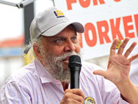 Retired lawyer and local resident Amarjeet Sidhu speaks to participants during a protest rally at an international students' encampment in B...