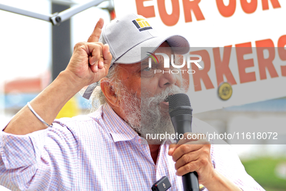 Retired lawyer and local resident Amarjeet Sidhu speaks to participants during a protest rally at an international students' encampment in B...