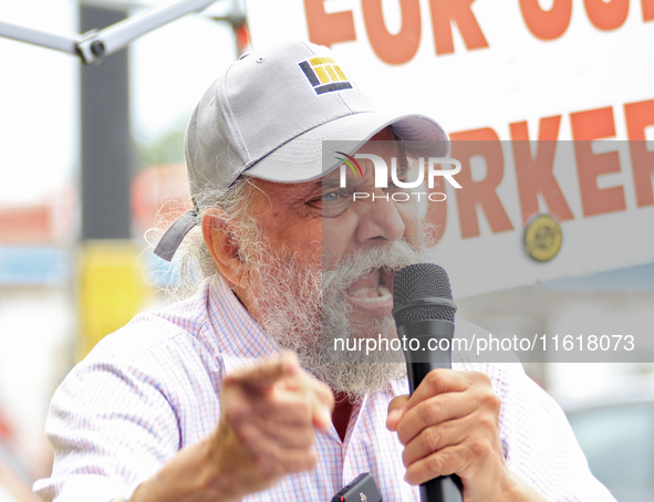 Retired lawyer and local resident Amarjeet Sidhu speaks to participants during a protest rally at an international students' encampment in B...