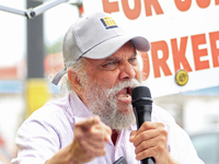 Retired lawyer and local resident Amarjeet Sidhu speaks to participants during a protest rally at an international students' encampment in B...