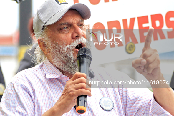 Retired lawyer and local resident Amarjeet Sidhu speaks to participants during a protest rally at an international students' encampment in B...