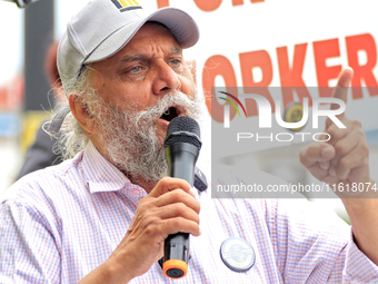 Retired lawyer and local resident Amarjeet Sidhu speaks to participants during a protest rally at an international students' encampment in B...