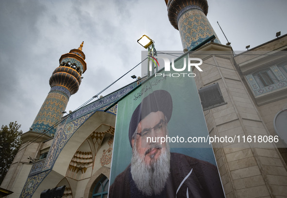 A billboard featuring a portrait of Lebanon's Hezbollah Secretary General, Hassan Nasrallah, who was killed in an Israeli air strike, stands...