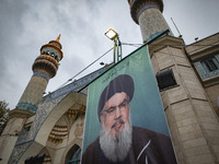 A billboard featuring a portrait of Lebanon's Hezbollah Secretary General, Hassan Nasrallah, who was killed in an Israeli air strike, stands...