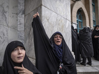 A veiled Iranian woman shouts anti-Israeli and anti-U.S. slogans while taking part in a protest gathering to condemn an Israeli air strike a...