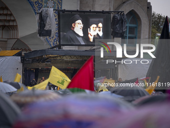 A display features a portrait of Lebanon's Hezbollah Secretary General, Hassan Nasrallah, during a protest gathering to condemn an Israeli a...