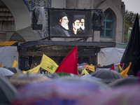 A display features a portrait of Lebanon's Hezbollah Secretary General, Hassan Nasrallah, during a protest gathering to condemn an Israeli a...