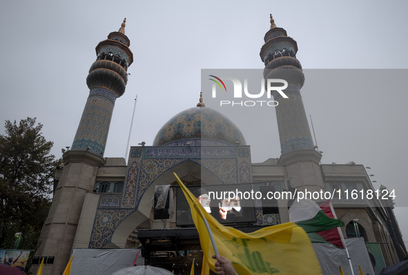 A display features a portrait of Lebanon's Hezbollah Secretary General, Hassan Nasrallah, during a protest gathering to condemn an Israeli a...