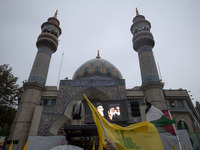 A display features a portrait of Lebanon's Hezbollah Secretary General, Hassan Nasrallah, during a protest gathering to condemn an Israeli a...