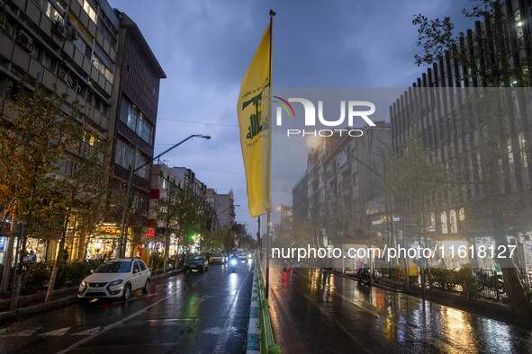 An avenue is decorated with a Lebanon's Hezbollah flag during a protest gathering to condemn an Israeli air strike against Hezbollah's headq...