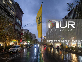 An avenue is decorated with a Lebanon's Hezbollah flag during a protest gathering to condemn an Israeli air strike against Hezbollah's headq...