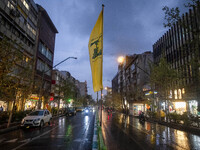 An avenue is decorated with a Lebanon's Hezbollah flag during a protest gathering to condemn an Israeli air strike against Hezbollah's headq...