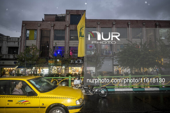 An avenue is decorated with a Lebanon's Hezbollah flag during a protest gathering to condemn an Israeli air strike against Hezbollah's headq...