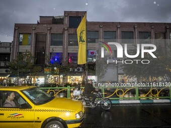 An avenue is decorated with a Lebanon's Hezbollah flag during a protest gathering to condemn an Israeli air strike against Hezbollah's headq...