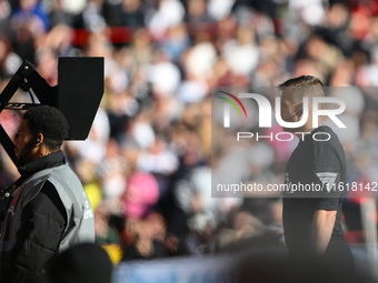 Referee Joshua Smith at the VAR screen during the Premier League match between Nottingham Forest and Fulham at the City Ground in Nottingham...