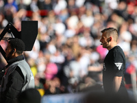 Referee Joshua Smith at the VAR screen during the Premier League match between Nottingham Forest and Fulham at the City Ground in Nottingham...