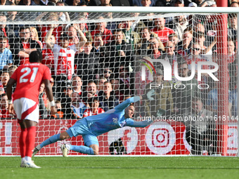 Matz Sels, Nottingham Forest goalkeeper, dives for the ball as Fulham scores from the penalty spot during the Premier League match between N...