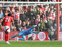 Matz Sels, Nottingham Forest goalkeeper, dives for the ball as Fulham scores from the penalty spot during the Premier League match between N...