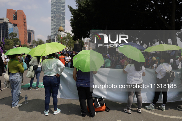 Feminist groups with umbrellas march from the Glorieta de las Mujeres que Luchan to the Zocalo in Mexico City, Mexico, on September 28, 2024...