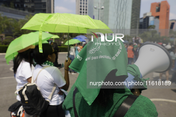 Feminist groups with umbrellas march from the Glorieta de las Mujeres que Luchan to the Zocalo in Mexico City, Mexico, on September 28, 2024...