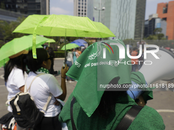 Feminist groups with umbrellas march from the Glorieta de las Mujeres que Luchan to the Zocalo in Mexico City, Mexico, on September 28, 2024...