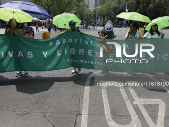 Various feminist collectives march in Mexico City, Mexico, on September 28, 2024, from various points to the capital's Zocalo to mark the Gl...