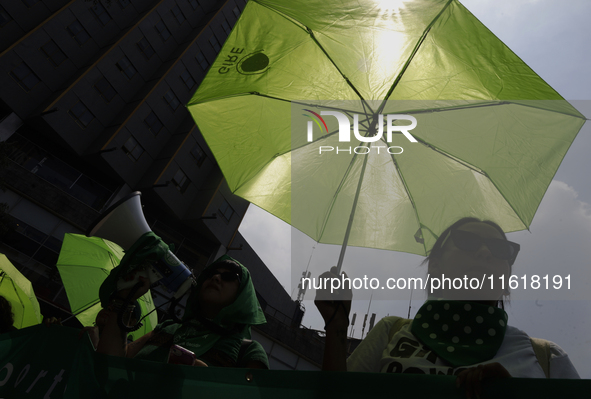 Feminist groups with umbrellas march from the Glorieta de las Mujeres que Luchan to the Zocalo in Mexico City, Mexico, on September 28, 2024...