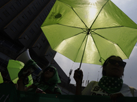 Feminist groups with umbrellas march from the Glorieta de las Mujeres que Luchan to the Zocalo in Mexico City, Mexico, on September 28, 2024...