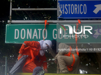 Feminist women intervene on road signs in Mexico City, Mexico, on September 28, 2024, where dozens of women march from the Glorieta de las M...