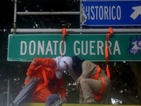 Feminist women intervene on road signs in Mexico City, Mexico, on September 28, 2024, where dozens of women march from the Glorieta de las M...