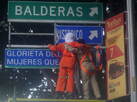 Feminist women intervene on road signs in Mexico City, Mexico, on September 28, 2024, where dozens of women march from the Glorieta de las M...