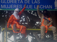 Feminist women intervene on road signs in Mexico City, Mexico, on September 28, 2024, where dozens of women march from the Glorieta de las M...