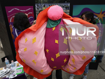 A feminist woman disguises herself as a vulva in Mexico City, Mexico, on September 28, 2024, where dozens of women march from the Glorieta d...