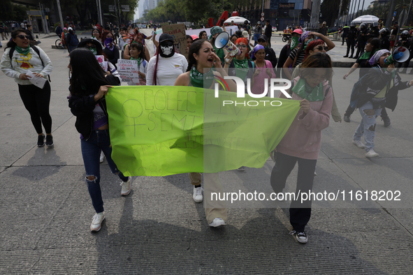 Various feminist collectives march in Mexico City, Mexico, on September 28, 2024, from various points to the capital's Zocalo to mark the Gl...