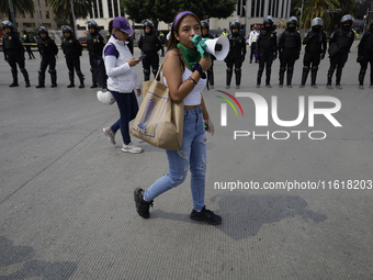 Various feminist collectives march in Mexico City, Mexico, on September 28, 2024, from various points to the capital's Zocalo to mark the Gl...