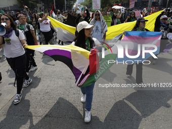 Various feminist collectives march in Mexico City, Mexico, on September 28, 2024, from various points to the capital's Zocalo to mark the Gl...