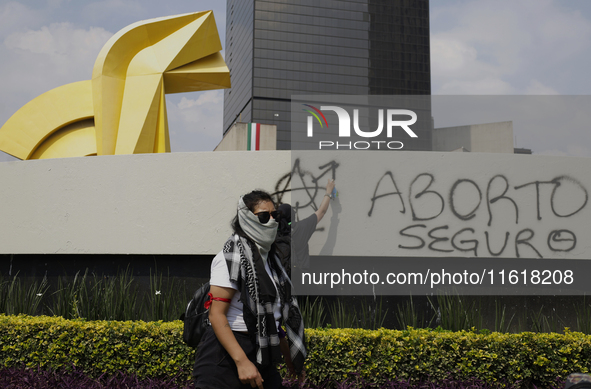 Feminist Black Bloc carries out direct action on September 28, 2024, and marches from the Glorieta de las Mujeres que Luchan to the Zocalo i...