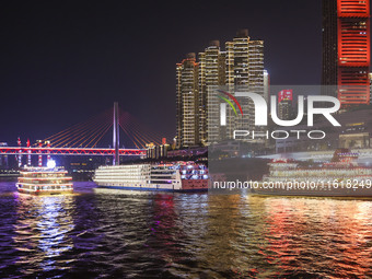 Tourists take a cruise to travel in Chongqing, China, on September 28, 2024. (