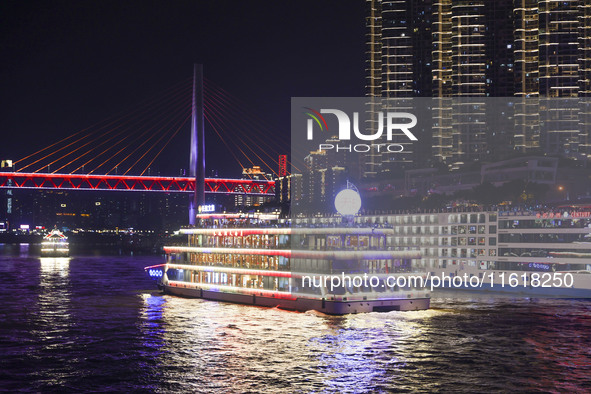 Tourists take a cruise to travel in Chongqing, China, on September 28, 2024. 