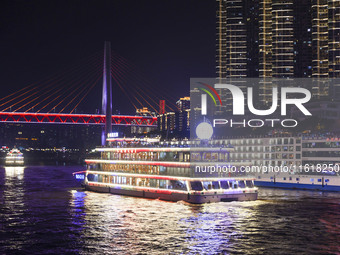 Tourists take a cruise to travel in Chongqing, China, on September 28, 2024. (