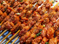 Mutton skewers are displayed at a barbecue stand at a night market in Nanning, China, on April 13, 2024. (