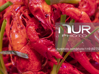 Crayfish are displayed at a barbecue stall at a night market in Nanning, China, on April 13, 2024. (