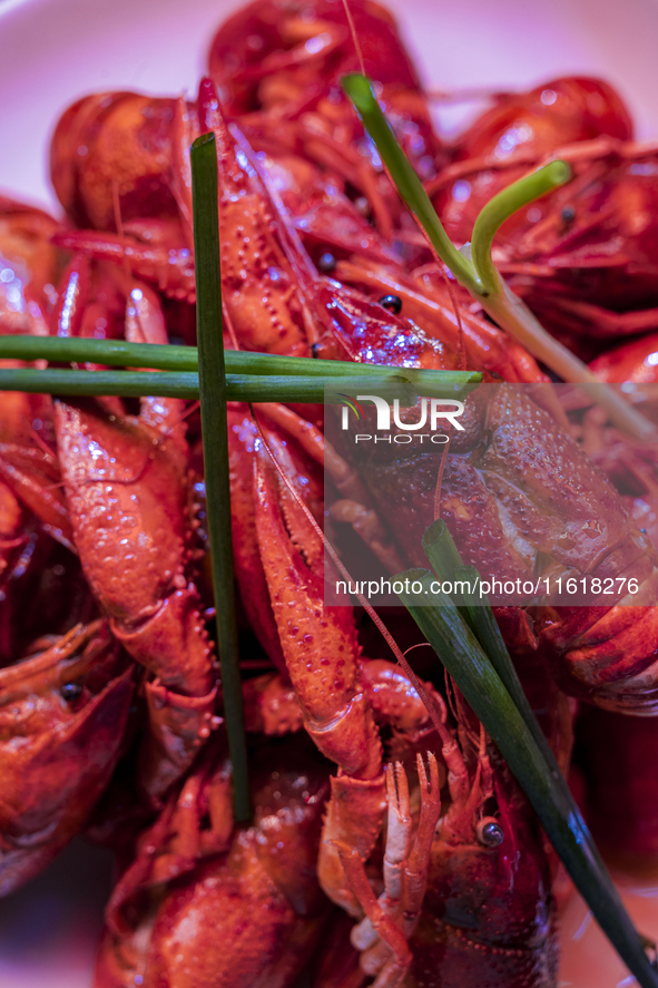 Crayfish are displayed at a barbecue stall at a night market in Nanning, China, on April 13, 2024. 