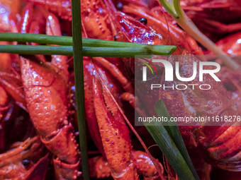 Crayfish are displayed at a barbecue stall at a night market in Nanning, China, on April 13, 2024. (