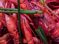 Crayfish are displayed at a barbecue stall at a night market in Nanning, China, on April 13, 2024. (