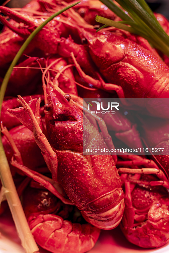 Crayfish are displayed at a barbecue stall at a night market in Nanning, China, on April 13, 2024. 