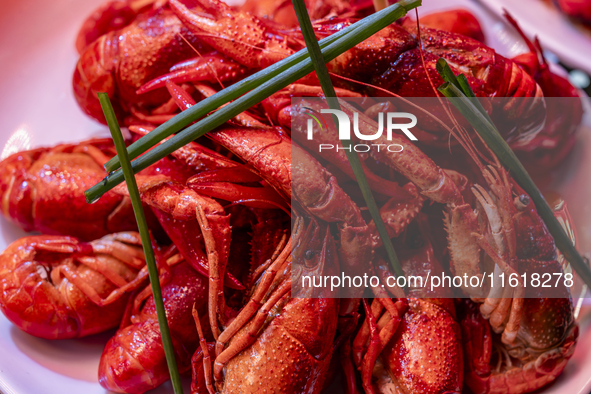 Crayfish are displayed at a barbecue stall at a night market in Nanning, China, on April 13, 2024. 