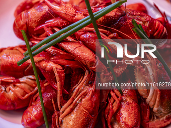 Crayfish are displayed at a barbecue stall at a night market in Nanning, China, on April 13, 2024. (