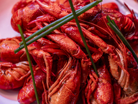 Crayfish are displayed at a barbecue stall at a night market in Nanning, China, on April 13, 2024. (